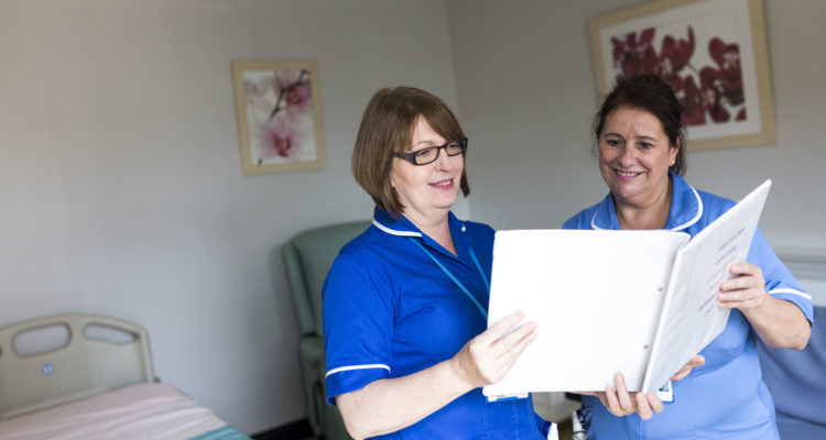 Nurses looking at a report