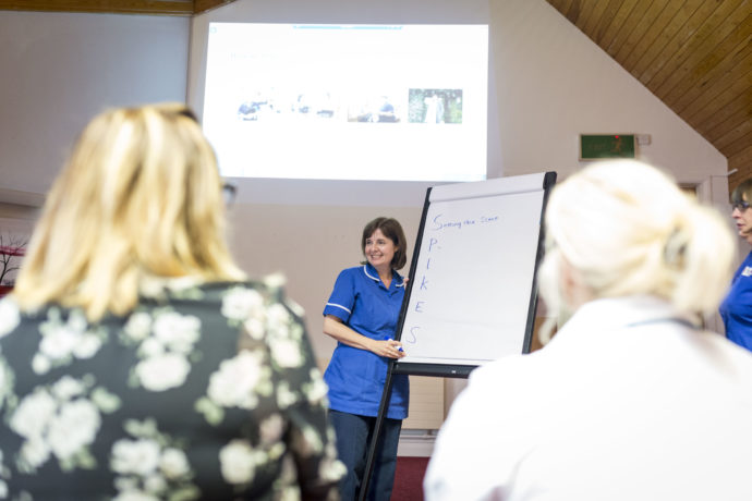 Nurse leading a training session