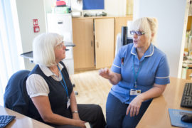 Two women talking in the office
