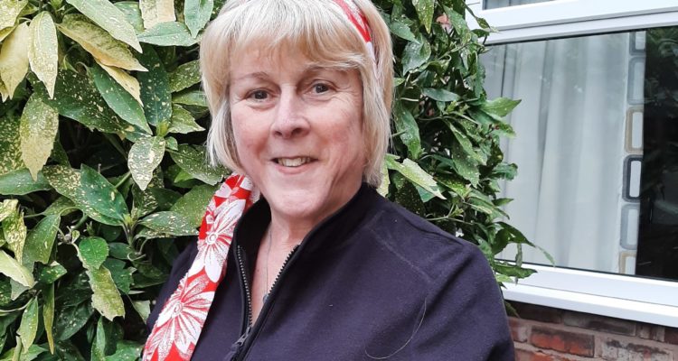 Sandra Rycroft in homemade banner for the Manchester Virtual Walk