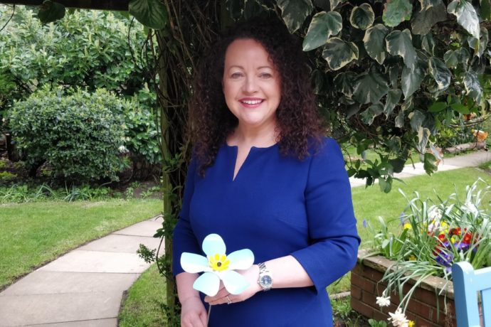 Rachel McMillan with forget-me-not flower