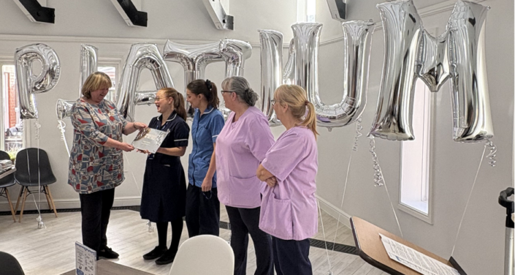Unveiling We invest in people Platinum award plaque from Investors in People at Little Hulton hospice